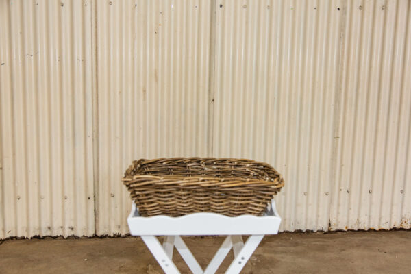 Cane basket with white cross over stand