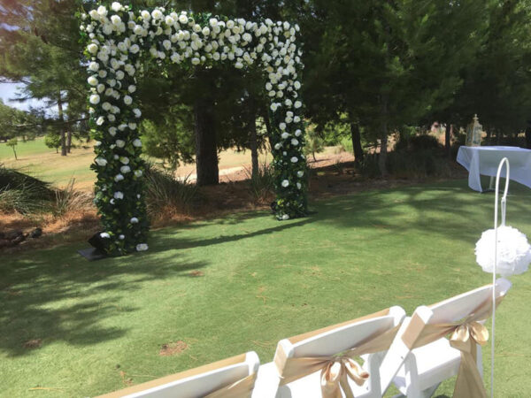 White floral and greenery arch