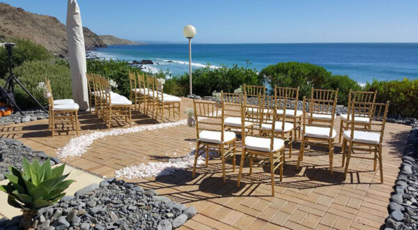 Gold chivari chairs with white cushions