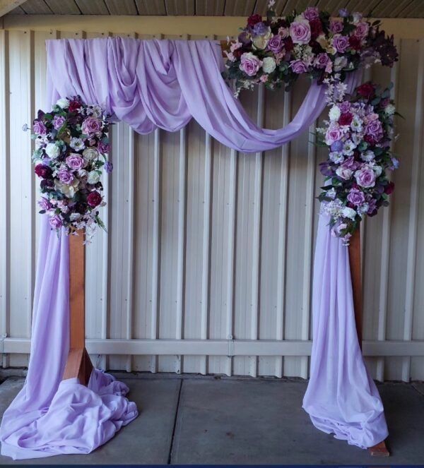 Violet included arch, drapery and artificial real touch florals and greenery