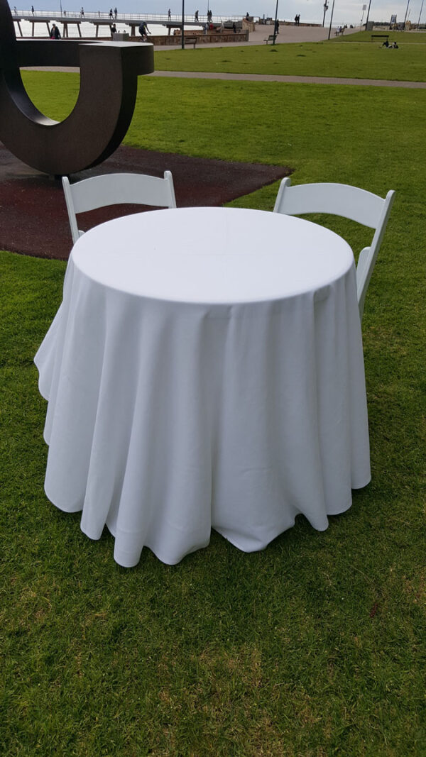 Signing table with white linens and 2 matching chairs